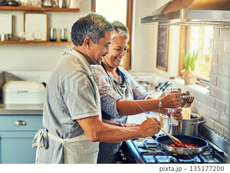 Help, cooking together and old couple in kitchen with smile, health and frying healthy food at stove. Love, senior man helping happy woman prepare lunch and meal in pan, retirement and dinner in home Help, cooking together and old couple in kitchen with smile, health and frying healthy food at stove. Love, senior man helping happy woman prepare lunch and meal in pan, retirement and dinner in home 135177200
