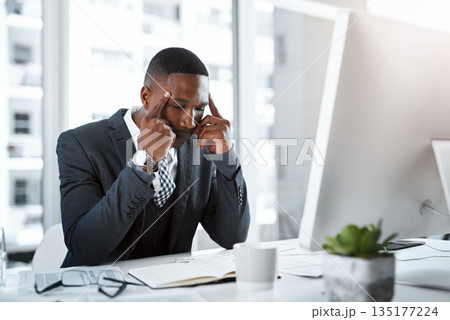 Corporate black man, headache and stress in workplace with burnout, depression and pain in office. Male professional at desk, migraine and tired person, overworked with anxiety and business crisis Corporate black man, headache and stress in workplace with burnout, depression and pain in office. Male professional at desk, migraine and tired person, overworked with anxiety and business crisis 135177224