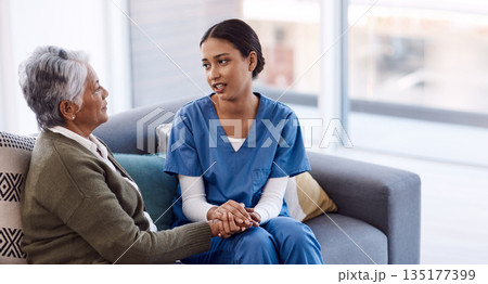 Old woman, holding hands or consulting a nurse for support or empathy for healthcare help for cancer therapy. Talking, psychology or elderly sick patient in counseling with caregiver in consultation Old woman, holding hands or consulting a nurse for support or empathy for healthcare help for cancer therapy. Talking, psychology or elderly sick patient in counseling with caregiver in consultation 135177399