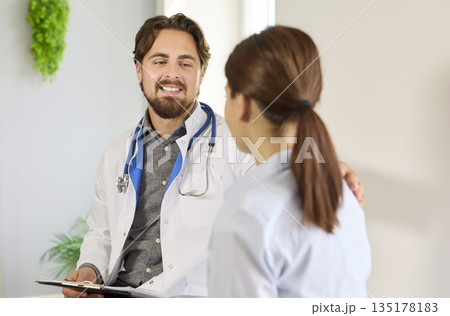 Medical support and care of doctor to woman patient at consultation in hospital 135178183