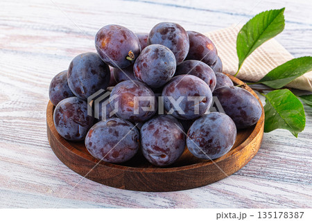 Juicy sweet ripe blue plums 135178387