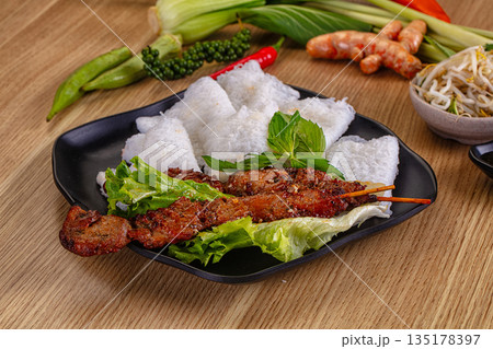 Tasty asian grilled pork skewer Tasty asian grilled pork skewer 135178397