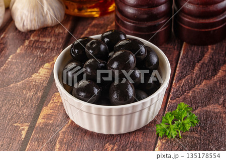 Mediterranean marinated Black olives in the bowl Mediterranean marinated Black olives in the bowl 135178554