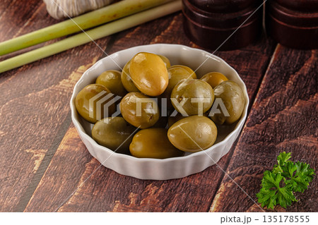Greek green olives marinated in the bowl Greek green olives marinated in the bowl 135178555