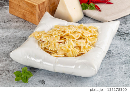 Italian pasta Farfalle with oil 135178590