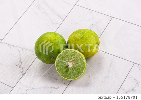 Fresh sour green lime fruit Fresh sour green lime fruit 135178701