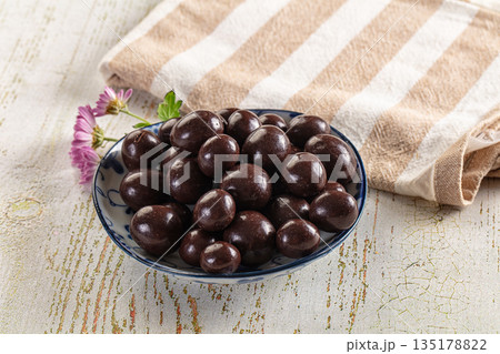 Nut in chocolate balls sweet candy 135178822