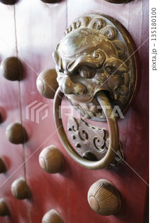 Beautiful entrance design of Buddha Tooth Relic Temple in Chinatown Singapore with ornate lion door knocker and traditional decorations Beautiful entrance design of Buddha Tooth Relic Temple in Chinatown Singapore with ornate lion door knocker and traditional decorations 135180100