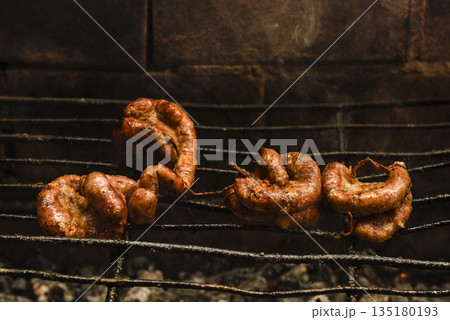 Cow bowels presented on a wooden board with ingredients, ready to grill 135180193