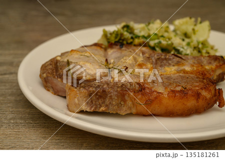 Crispy Pork Chop with Herb-Roasted Cauliflower and Broccoli Crispy Pork Chop with Herb-Roasted Cauliflower and Broccoli 135181261