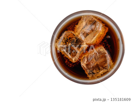 Overhead Shot of Coca-Cola Glass with Ice on White Backdrop 135181609