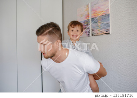 Smiling Father Playing with Happy Toddler Smiling Father Playing with Happy Toddler 135181716