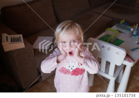 Surprised child looking with amazement, Wow emotion and unexpected news concept. Surprised child looking with amazement, Wow emotion and unexpected news concept. 135181738
