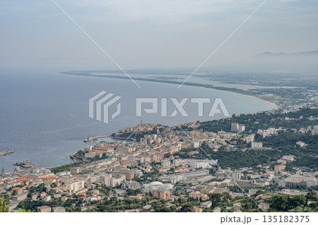 Aerial view Mountain Viewpoint of Bastia in the north of Corsica island - Genoese city overlooking the Mediterranean Sea Aerial view Mountain Viewpoint of Bastia in the north of Corsica island - Genoese city overlooking the Mediterranean Sea 135182375