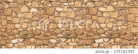 Ancient rough hewn stone wall texture pattern 135182385