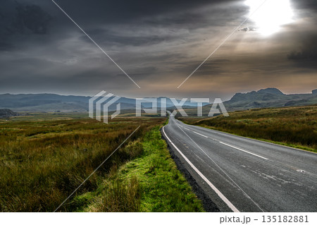 Abandoned Road Through Spectacular Rural Landscape Of Snowdonia National Park In North Wales, United Kingdom Abandoned Road Through Spectacular Rural Landscape Of Snowdonia National Park In North Wales, United Kingdom 135182881