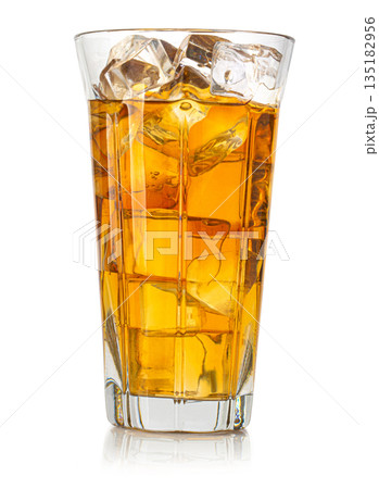 Glass of refreshing iced tea with ice cubes Glass of refreshing iced tea with ice cubes 135182956