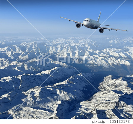 Airplane flying over snow capped alps mountains 135183178