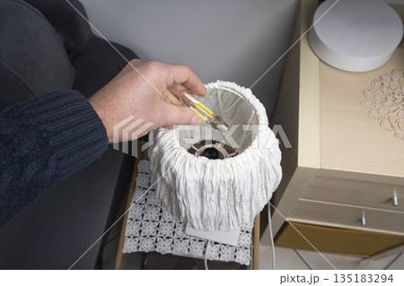 changing the light bulb 135183294