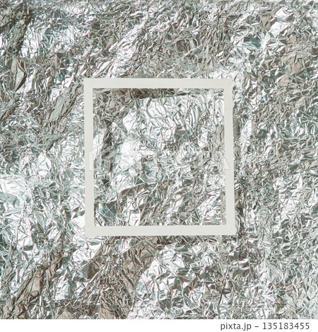 Abstract geometric composition with white square frame on crinkled silver foil Abstract geometric composition with white square frame on crinkled silver foil 135183455
