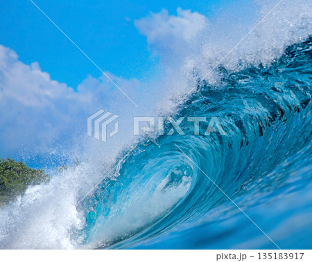 Vast Ocean Wave Crashing Fiercely, Powerful Surf Surging Beneath Bright Sky 135183917