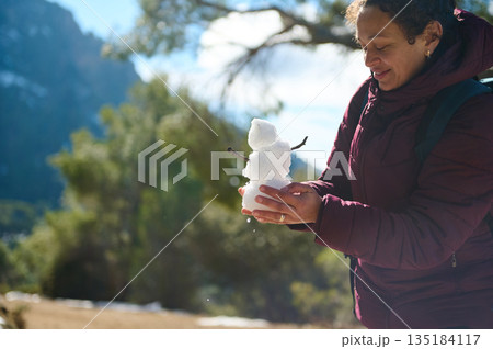 Woman Outdoors With Snow Snowman Snowball In Hand In Bright Winter Forest 135184117