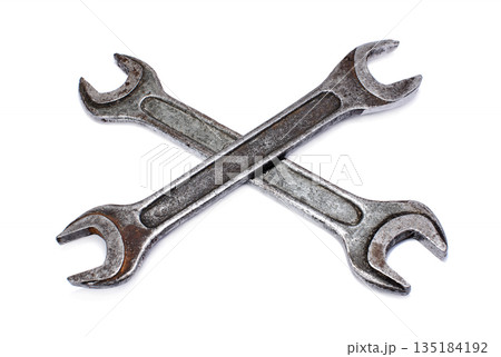 Crossed wrenches on a white background Crossed wrenches on a white background 135184192