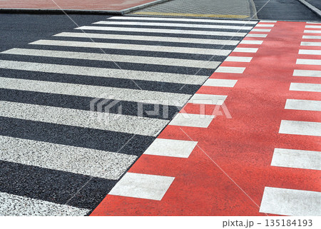 Crosswalk and bike trail on a city highway Crosswalk and bike trail on a city highway 135184193