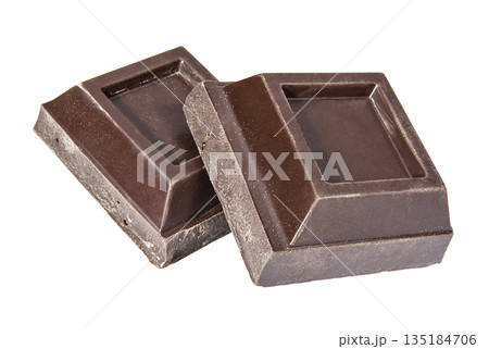 Dark chocolate square pieces on a white background 135184706