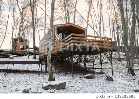 cluster of elevated modular cabins connected by walkways cluster of elevated modular cabins connected by walkways 135185693