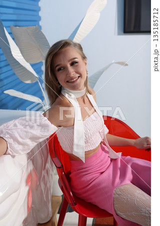 Model exudes confidence in vibrant magazine test photograph Model exudes confidence in vibrant magazine test photograph 135185712