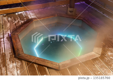 Symmetrical octagonal plunge illuminated by glowing neon lights Symmetrical octagonal plunge illuminated by glowing neon lights 135185760