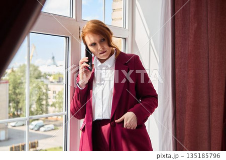 White woman with red hair delivering media statement outdoors White woman with red hair delivering media statement outdoors 135185796