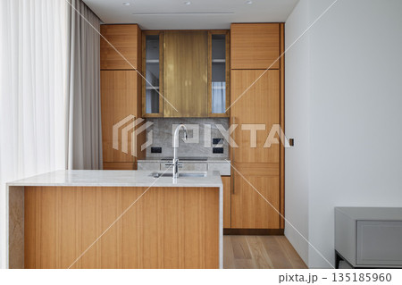 Sophisticated cooking space with elegant details and smart layout design 135185960