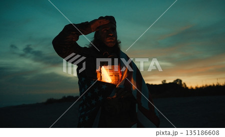 Silhouette of an American soldier saluting in front of the sunset a Memorial Day Silhouette of an American soldier saluting in front of the sunset a Memorial Day 135186608