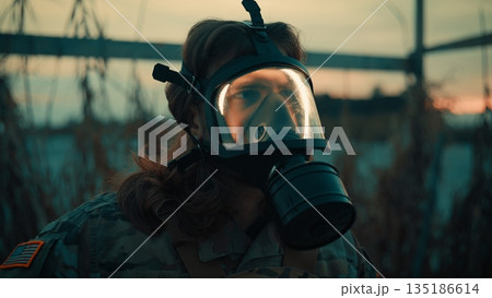 American soldier ready for service in gas mask for chemical warfare 135186614