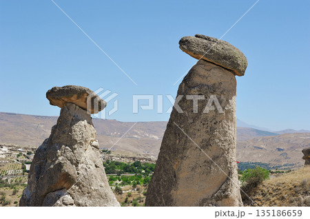 "Three Beauties" are rock formations located near the city of Urgup in Cappadocia "Three Beauties" are rock formations located near the city of Urgup in Cappadocia 135186659