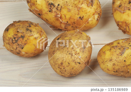 young whole potatoes in their skins, 135186989