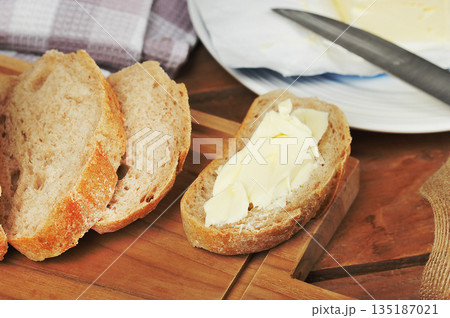butter and bread sandwich on a wooden butter and bread sandwich on a wooden 135187021