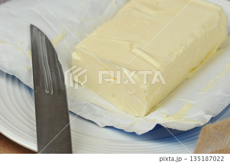 butter and a knife in butter butter and a knife in butter 135187022