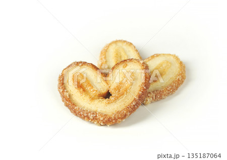 cookies in the shape of an ear on a white background 135187064