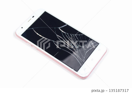 White phone with a broken screen on a white background. 135187317