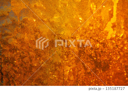 Golden sun shining through frozen window Golden sun shining through frozen window 135187727