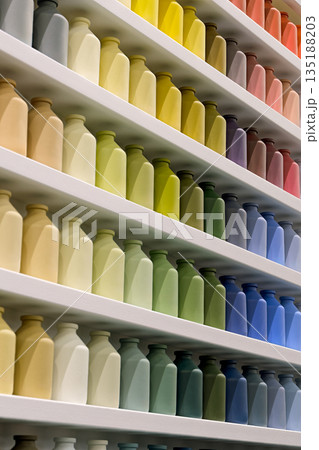Many small jars of the same shape and size, different colors Many small jars of the same shape and size, different colors 135188203