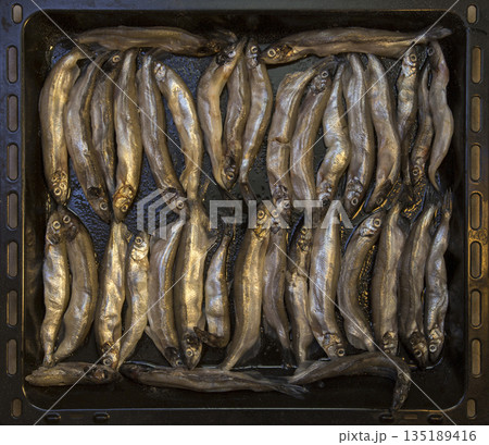 Frying pan with capelin before frying Frying pan with capelin before frying 135189416