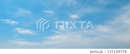 Sky panorama with fluffy and thin clouds creating dynamic texture and contrast across open aerial view 135189738