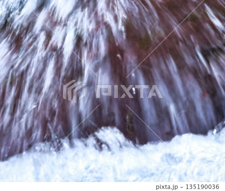 Blurred Rock in Flowing River 135190036