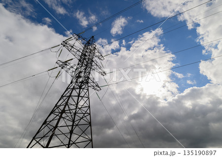 Power Lines Stand Out Against a Dramatic and Colorful Sky Filled with Unique Clouds 135190897