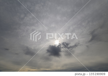 A Dramatic Cloudy Sky with Beautiful Sunlight Peeking Through the Overcast Environment A Dramatic Cloudy Sky with Beautiful Sunlight Peeking Through the Overcast Environment 135190909
