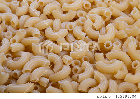 Uncooked spiral pasta provides nutrition, Plain raw macaroni offers necessary diet information, Unprocessed shaped pasta delivers key nutrients and energy sources Uncooked spiral pasta provides nutrition, Plain raw macaroni offers necessary diet information, Unprocessed shaped pasta delivers key nutrients and energy sources 135191384